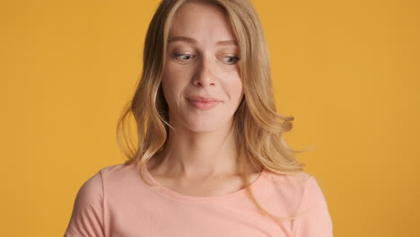 caucasian woman looking around on camera.