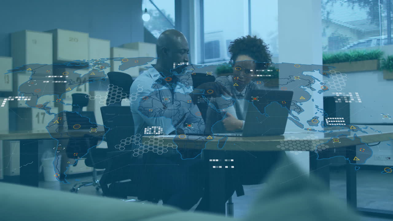 Collaborating at desk, business professionals using animation with digital world map