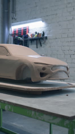 clay model of a car prototype in a workshop