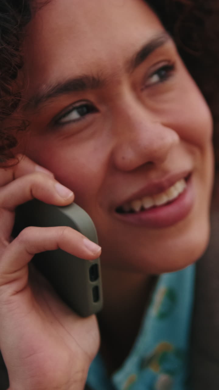 Woman Talking on Mobile Phone Outdoors