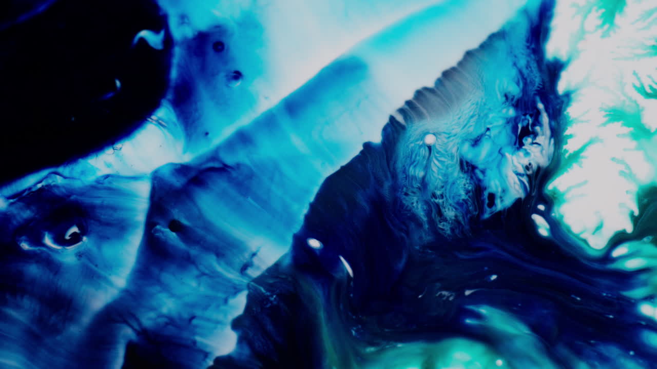 Vibrant fractal inks swirl on a light canvas, creating a dreamy feel