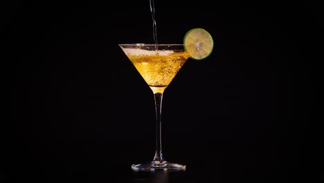 golden martini with lime