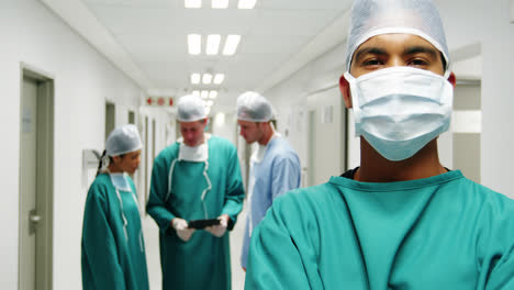 Portrait-of-male-surgeon-standing-with-arms-crossed