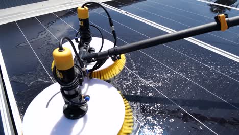 worker use machine to wash solar cell panel, daylight