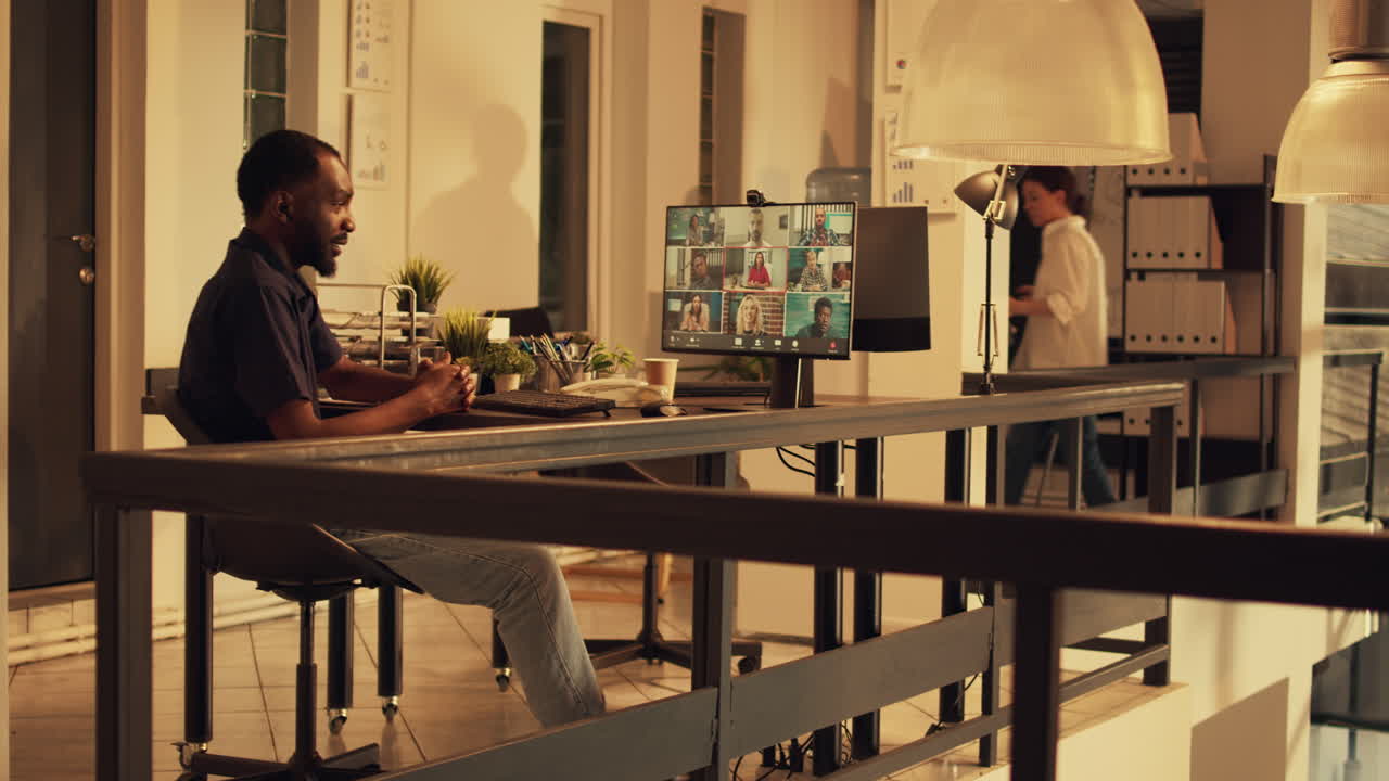 African american worker attending corporate videocall meeting