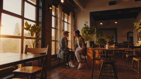 couple enjoying a sunset in a cozy cafe