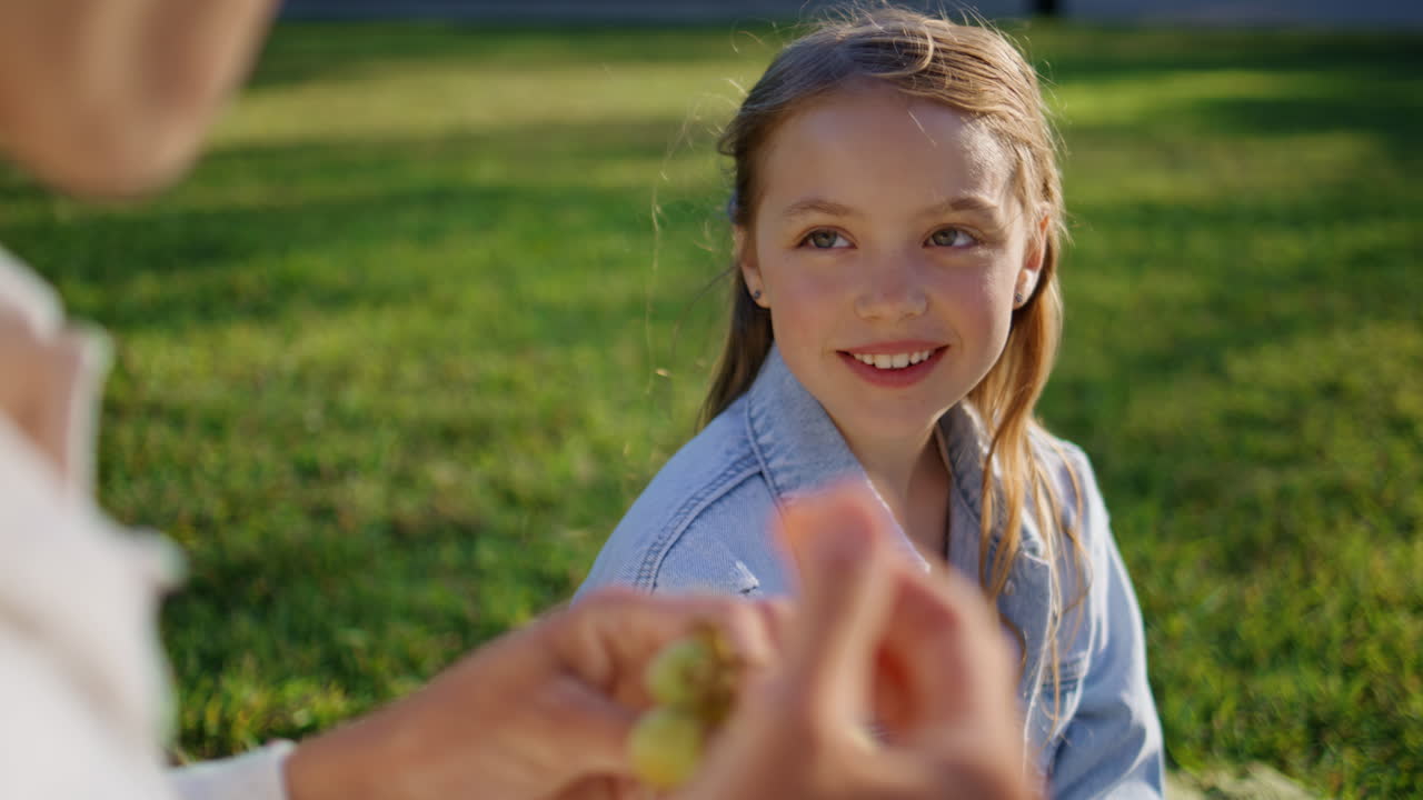 Cute child enjoying picnic park looking unknown mother at sunny day closeup