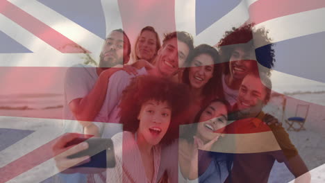 animation of flag of united kingdom waving over diverse friend taking selfie on cellphone