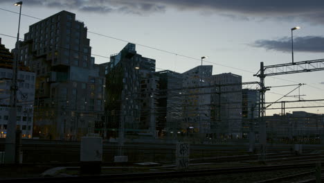 day to night timelapse of oslo central station and barcode