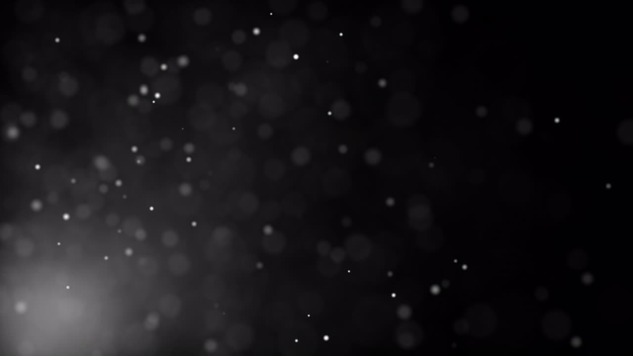 Abstract loop dust particles glow floating on black background with flare light on bottom left for your screen project overlay. 4K 3D seamless looping white particles dust fly in the air. Looped animation.