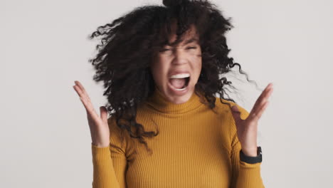 african american angry woman over white background.