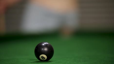 striking at the ball on the pool table, goa, india