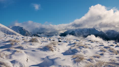 Beautiful-snowy-landscape-on-top-of-mountains-with-blue-sky-and-sunlight