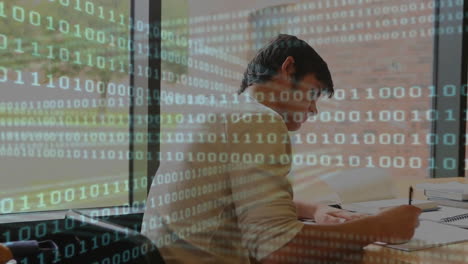 binary code animation over person studying at desk near window