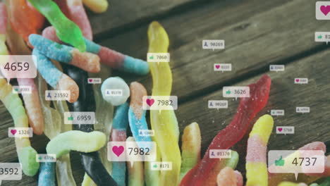 colorful gummy worms with social media likes and comments animation over them