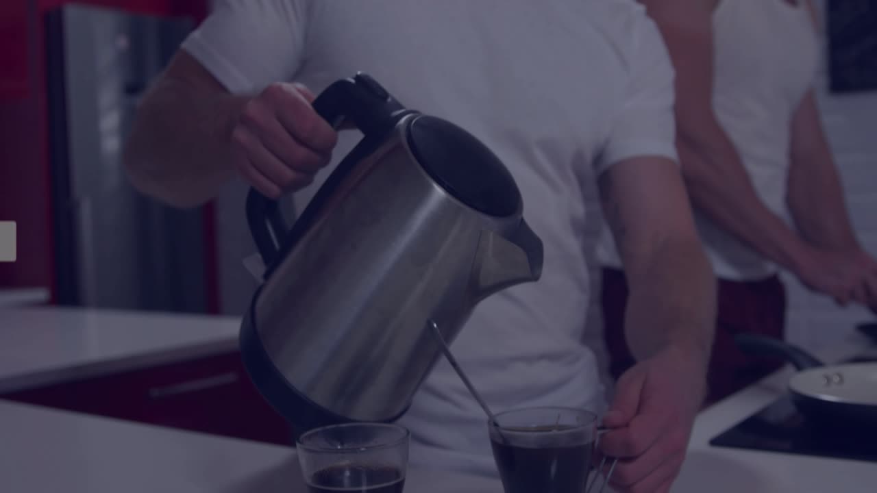 Man pouring hot water from electric kettle into glass mugs, activating live engagement overlays