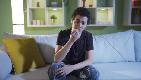 the frightened, worried young man is uneasy and unhappy because of his wrongdoing.