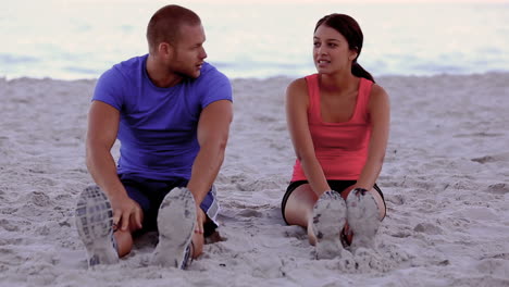 woman being coached on the beach