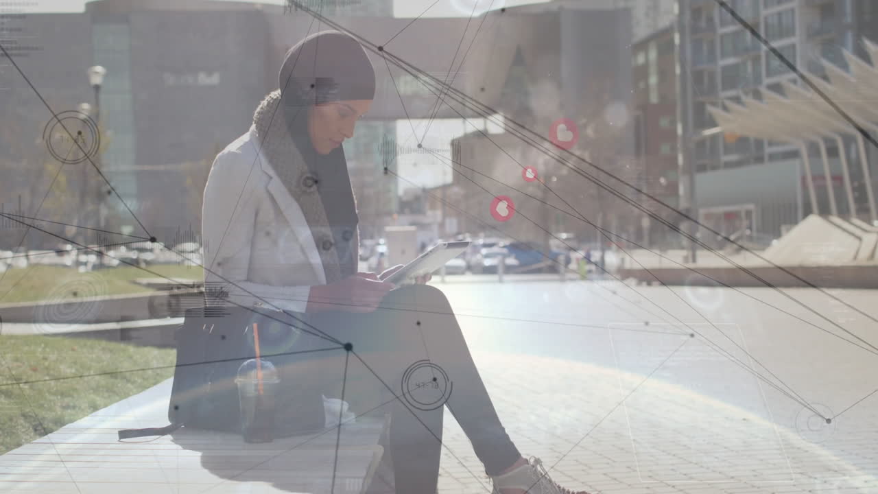 Using tablet with digital network animation, woman in hijab focusing in school