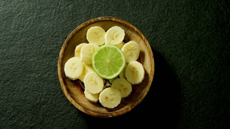 Lemon-and-sliced-banana-in-a-bowl-4k