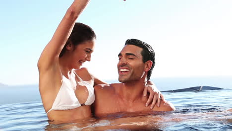 happy couple in a swimming pool