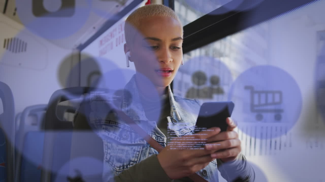 Animation of social media icons and data processing over biracial woman in bus using smartphone