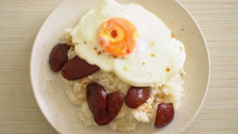 rice with fried egg and chinese sausage - homemade food in asian style