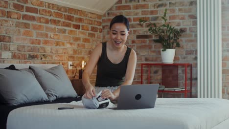 happy woman showing ultrasound images during video call