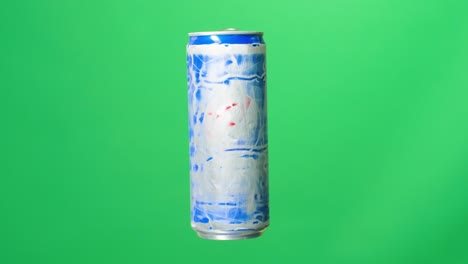 an empty soft drink can rotating on green screen background