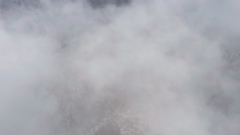 flying through cloudy mountains aerial drone shot thermessos, antalya, turkey