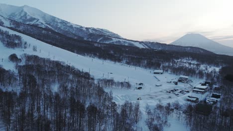 tracking shot of a backcountry ski slope resort in hokkaido, japan.