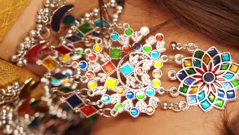 close-up of colorful ethnic necklace and earrings