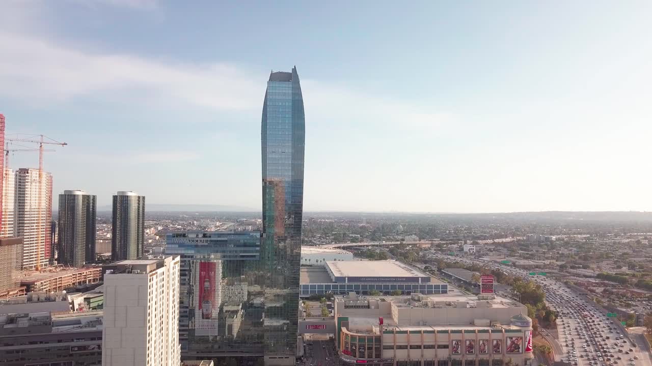 Aerial View of Downtown Los Angeles Skyscrapers, Convention Center, and Freeway Traffic