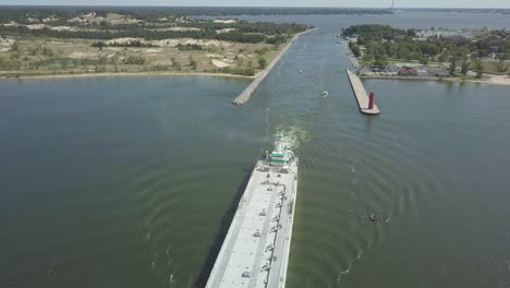 aerial view of large freighter moving out of canal in michigan, usa