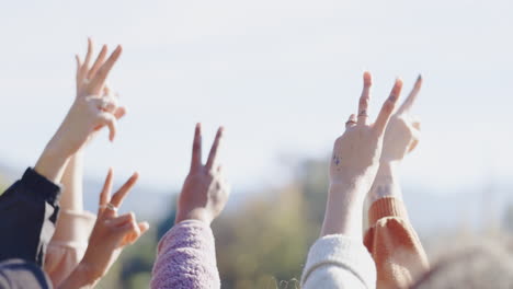 peace, hands and group outdoor with sign