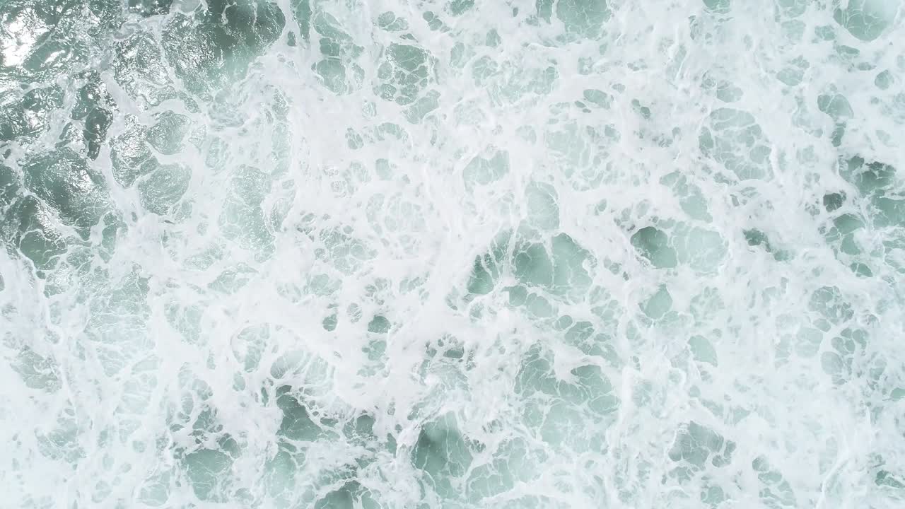 Aerial view. Aerial drone footage of ocean waves ,one turtle swimming in waves
