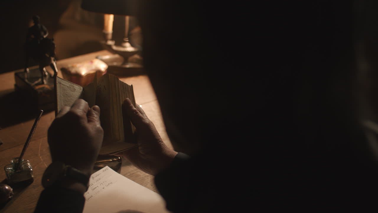 Old passionate man read a book in his office at night