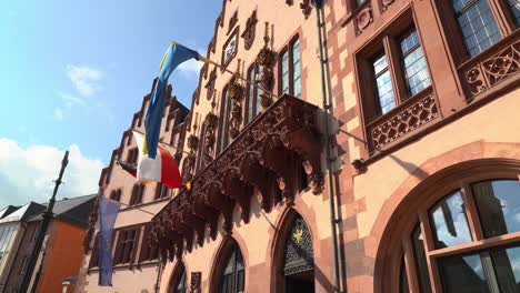 a row of historical half-timbered houses of römerberg square in frankfurt