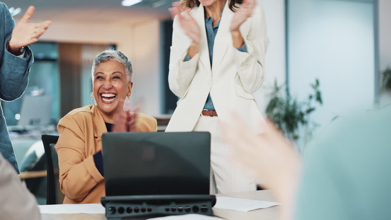 Team celebrates success in business meeting