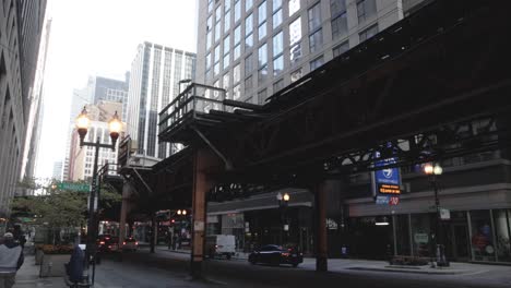 Downtown-Chicago,-Illinois-at-the-loop-with-gimbal-video-walking-forward-in-slow-motion