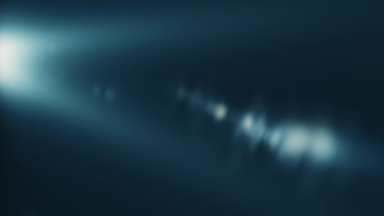 Abstract  flicker blue optical lens flares light rotation animation on top left black background. 4K seamless loop dynamic kinetic bright star light rays effect. Star light streaks.