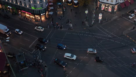 High-angle-view-of-evening-traffic-in-town.-Cars-driving-on-Rosenthaler-Platz.-Transport-in-city.-Berlin,-Germany