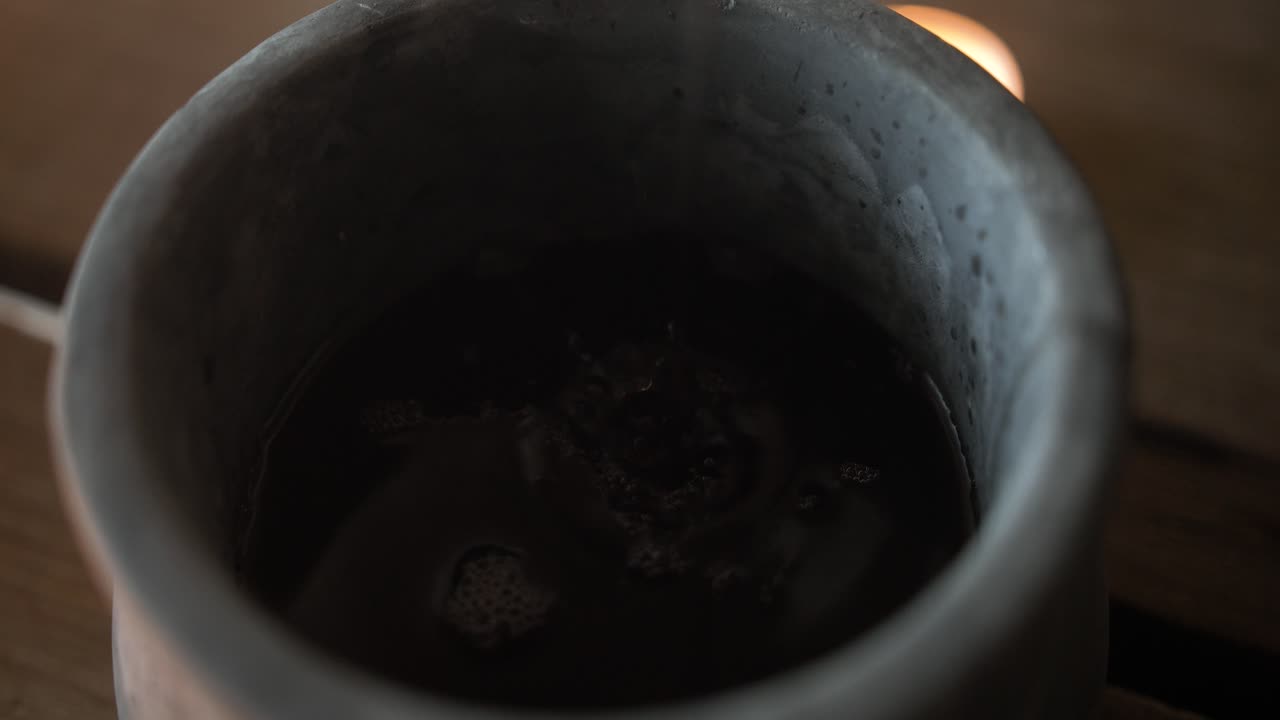 Closeup of wine in a clay jar for the last supper, communion, Christian sacraments, representing the blood of Jesus shed on the cross.