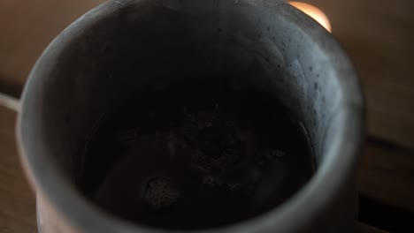 closeup of wine in a clay jar for the last supper, communion, christian sacraments, representing the blood of jesus shed on the cross.