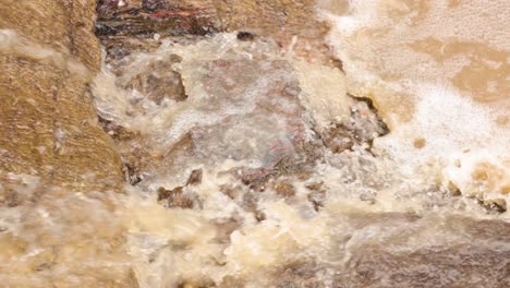 water rushing through a historic gold mine