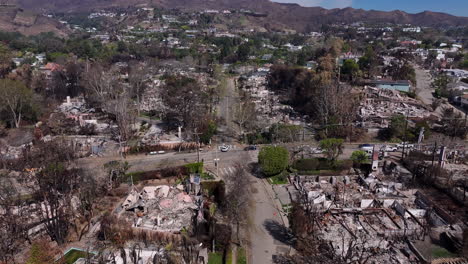 aerial view of a residential neighborhood devastated by wildfire aftermath