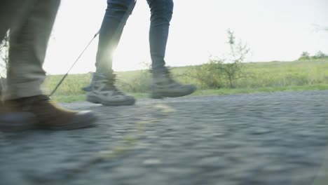 peoples foot while nordic hiking with lens flare