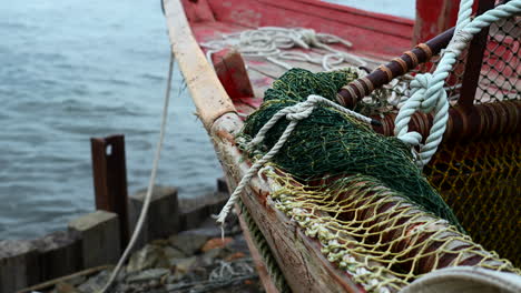 fishing boat at dock with fishing net