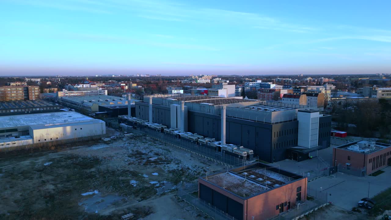 Large modern data center building providing essential services for artificial intelligence and cloud computing. Magic aerial view descending drone