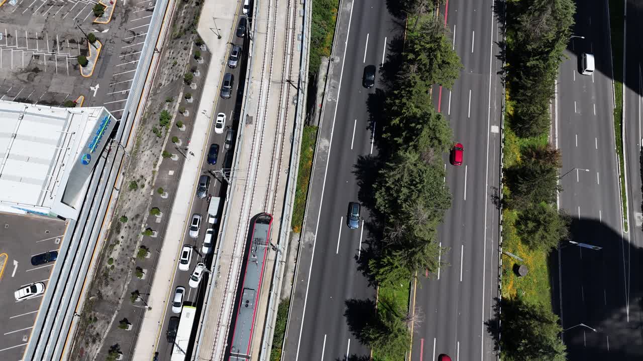 Aerial View of City Road with Traffic and Train